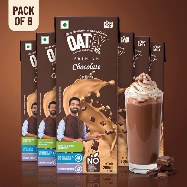 Oatey Premium Chocolate Oat Milk pack of 8 x 200 ml (1.6 L) cartons with a whipped-cream chocolate drink